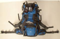 A tall blue and gray hiking backpack with multiple visible straps and compartments.